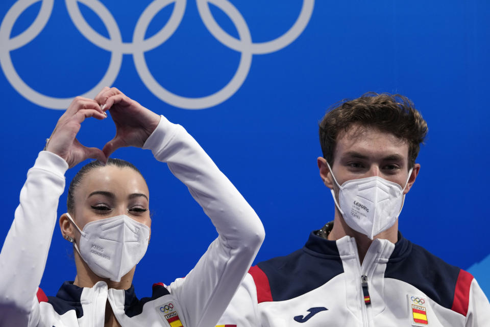 Laura Barquero and Marco Zandron, of Spain, react after the pairs short program during the figure skating competition at the 2022 Winter Olympics, Friday, Feb. 18, 2022, in Beijing. (AP Photo/Bernat Armangue)