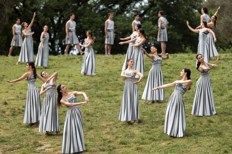 Actors and actresses take part in the official ceremony to light the flame for the Olympic Games in Paris on the site of ancient Olympia in Greece. Socrates Baltagiannis/