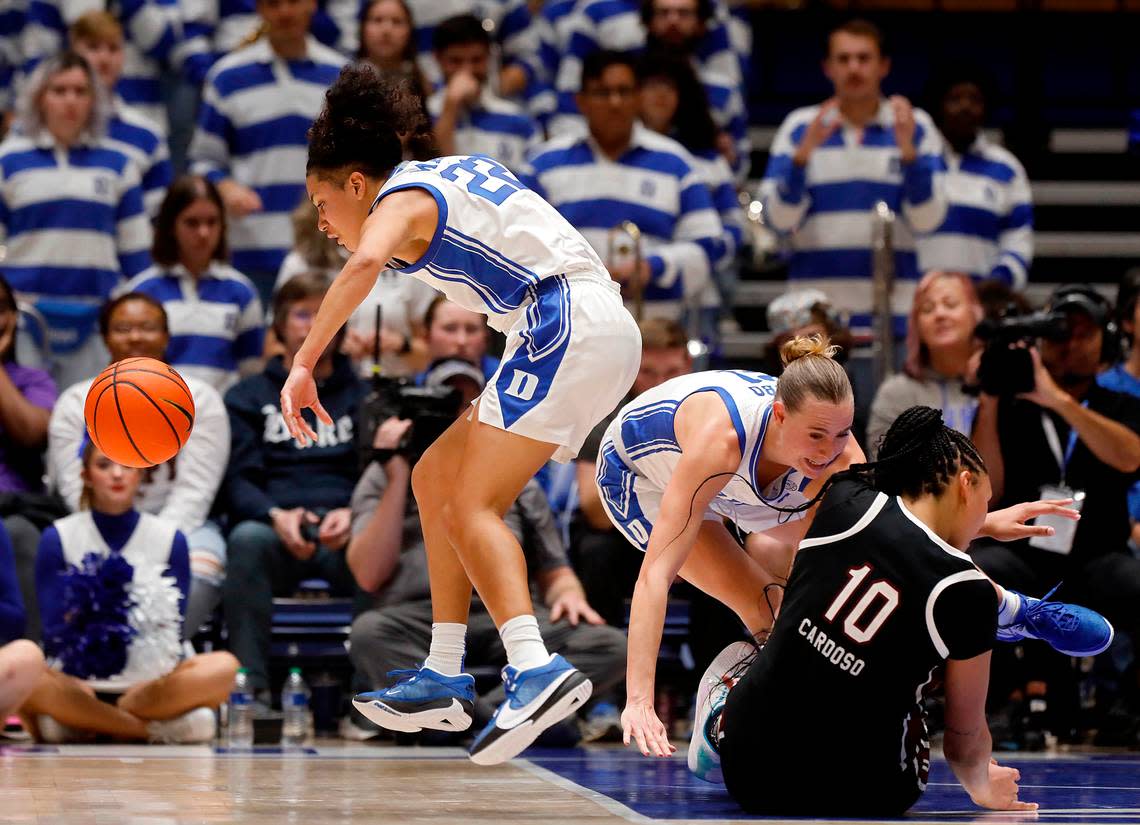 Duke’s Camilla Emsbo and South Carolina’s Kamilla Cardoso collide as Duke’s Taina Mair, left, chases after a loose ball during the second half of the Blue Devils’ 77-61 loss on Sunday, Dec. 3, 2023, at Cameron Indoor Stadium in Durham, N.C. Kaitlin McKeown/kmckeown@newsobserver.com