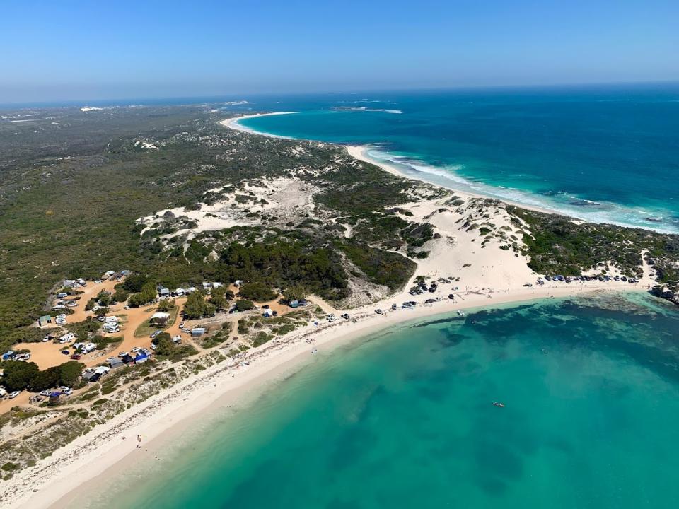 The pristine coastline of the Sandy Cape Recreation Park pictured from above.