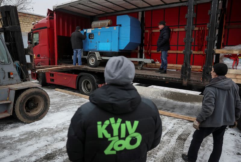 FILE PHOTO: Kyiv's zoo staff unload generators for heating animal enclosures, donated to them from the Berlin Zoo in Kyiv