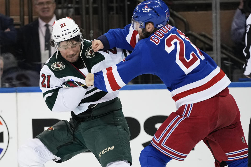 New York Rangers' Barclay Goodrow, right, punches Minnesota Wild's Brandon Duhaime during the first period of an NHL hockey game Thursday, Nov. 9, 2023, in New York. (AP Photo/Frank Franklin II)