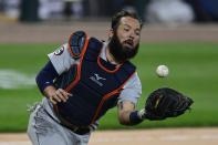 Detroit Tigers catcher Austin Romine catches a pop up hit by Chicago White Sox's Eloy Jimenez during the seventh inning of a baseball game Tuesday, Aug. 18, 2020, in Chicago. (AP Photo/Paul Beaty)