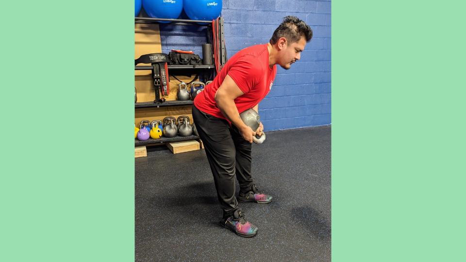 Gio Amatore performing RDL section of braced kettlebell RDL