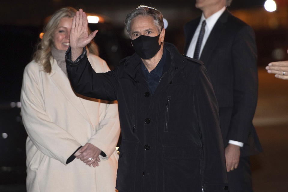 U.S. Secretary of State Antony Blinken, center, waves after disembarking from his airplane upon arrival at Copenhagen Airport in Copenhagen, Denmark, Sunday, May 16, 2021, on his first stop on a five-day European tour. (Saul Loeb/Pool Photo via AP)