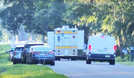 Jacksonville sheriff's officers investigate a police shooting early Sunday on Boney Road.