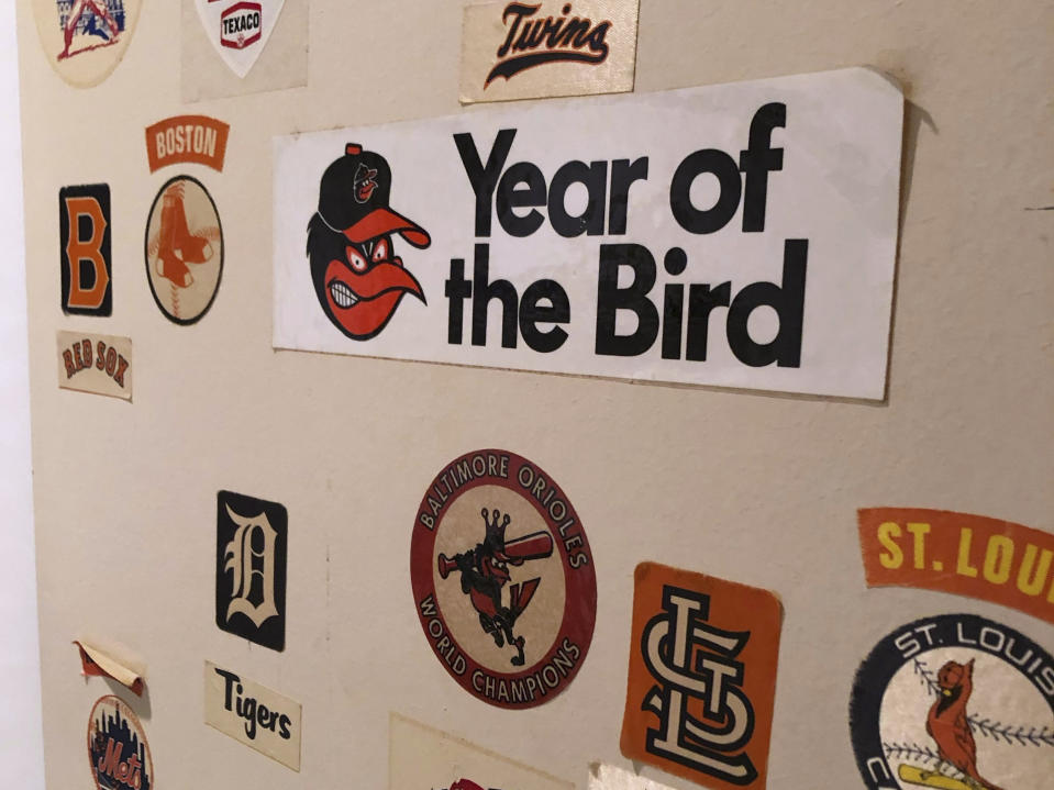 In a photo provided by Ben Walker, a Year of the Bird sticker from 1966 is among the items affixed to the door that leads to Walker's bedroom in his boyhood home, Tuesday, Sept. 26, 2023, in Rockville, Md. Robinson, whose deft glovework and folksy manner made him one of the most beloved and accomplished athletes in Baltimore history, has died. He was 86. (Ben Walker via AP)