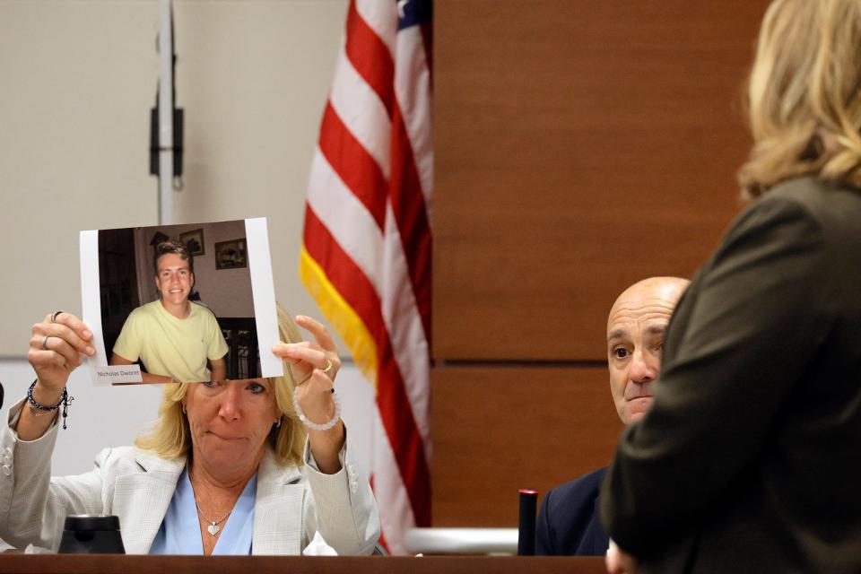 Annika Dworet holds a photo of her son, Nicholas, as she and her husband, Mitch, take the stand to give their witness impact statements during the penalty phase of the trial of Marjory Stoneman Douglas High School shooter Nikolas Cruz at the Broward County Courthouse in Fort Lauderdale on Tuesday, August 2, 2022. Nicholas was killed, and the Dworet’s other son, Alexander, was injured in the 2018 shootings. Cruz previously pleaded guilty to all 17 counts of premeditated murder and 17 counts of attempted murder in the 2018 shootings.