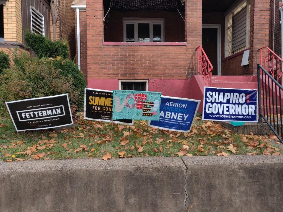 Political yard signs for various Democratic candidates posted in front of a house in Pittsburgh, Pennsylvania on November 2, 2022.