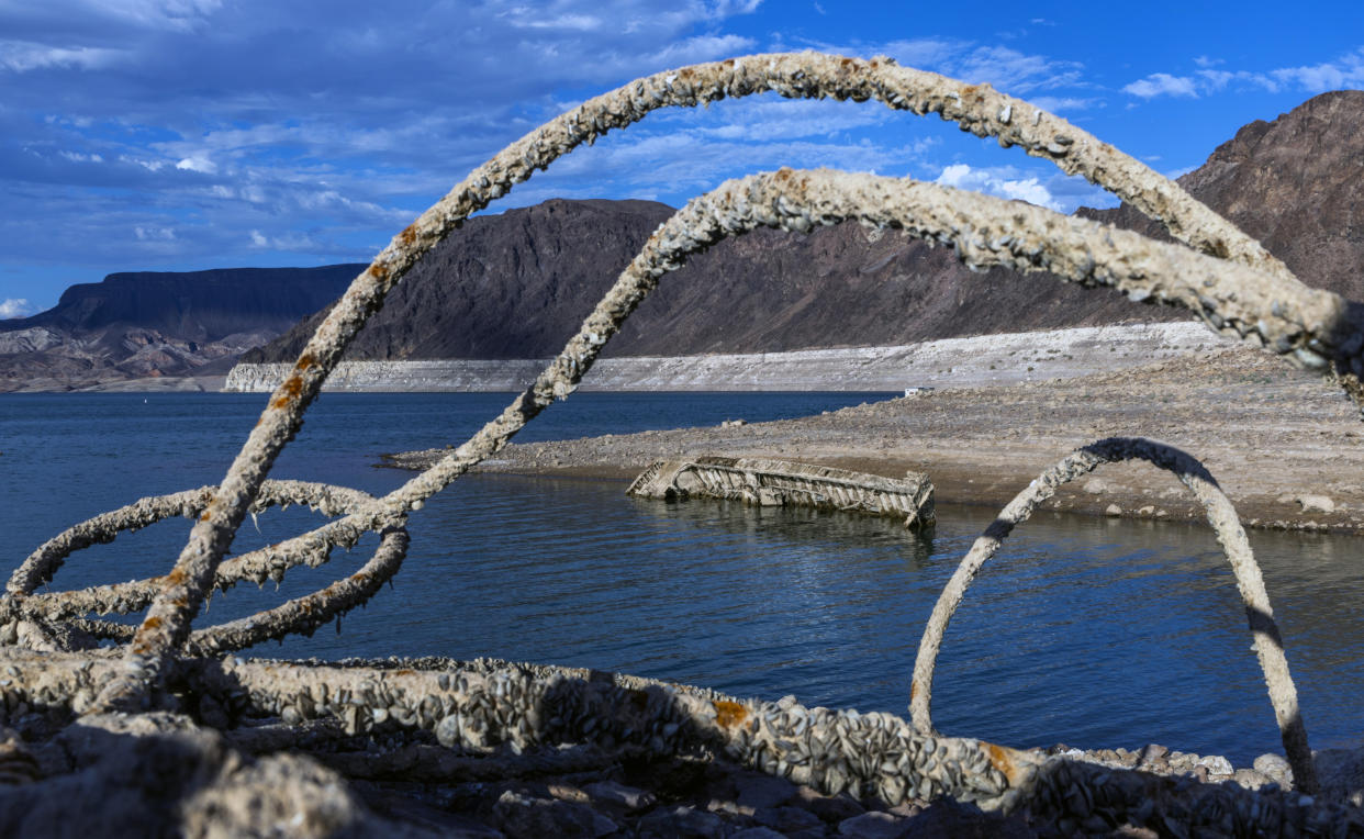 A WWII ear landing craft used to transport troops or tanks along with with old steel cable nearby was revealed on the shoreline near the Lake Mead Marina as the waterline continues to lower at the Lake Mead National Recreation Area on Thursday, June 30, 2022, in Boulder City. (L.E. Baskow/Las Vegas Review-Journal via AP)