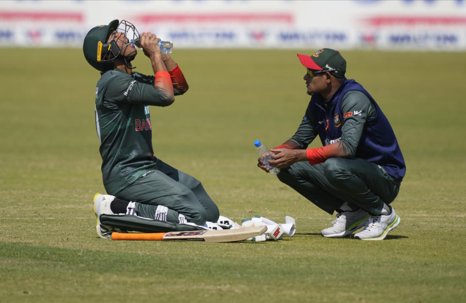 Bangladesh batsman Mohammad Mahmudullah drinks water during a break on the final day of the One-Day International cricket match between Zimbabwe and Bangladesh at Harare Sports Club in Harare, Zimbabwe, Wednesday, Aug, 10, 2022. (AP Photo/Tsvangirayi Mukwazhi)