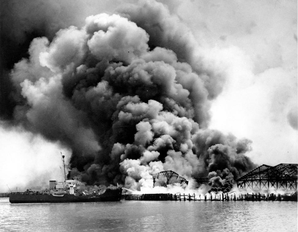 U.S. Coast Guard cutter Iris assists in fighting fire at the Monsanto Chemical Company refineries and oil storage tanks that exploded in the waterfront area in Texas City, Texas, on April 16, 1947.