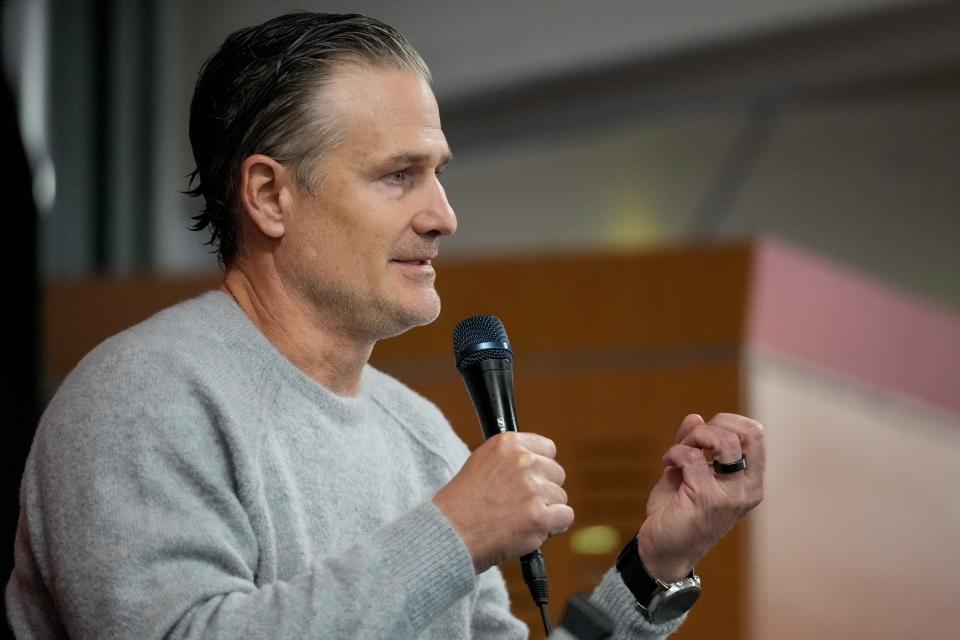 Reds manager David Bell takes questions from the audience during a Reds on Radio affiliates luncheon this offseason. Bell will be managing a team this season that added $108 million worth of free agents.