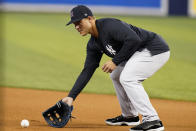 New York Yankees first baseman Anthony Rizzo fields a ball before the team's baseball game against the Miami Marlins, Friday, July 30, 2021, in Miami. Rizzo was acquired in a trade from the Chicago Cubs. (AP Photo/Lynne Sladky)