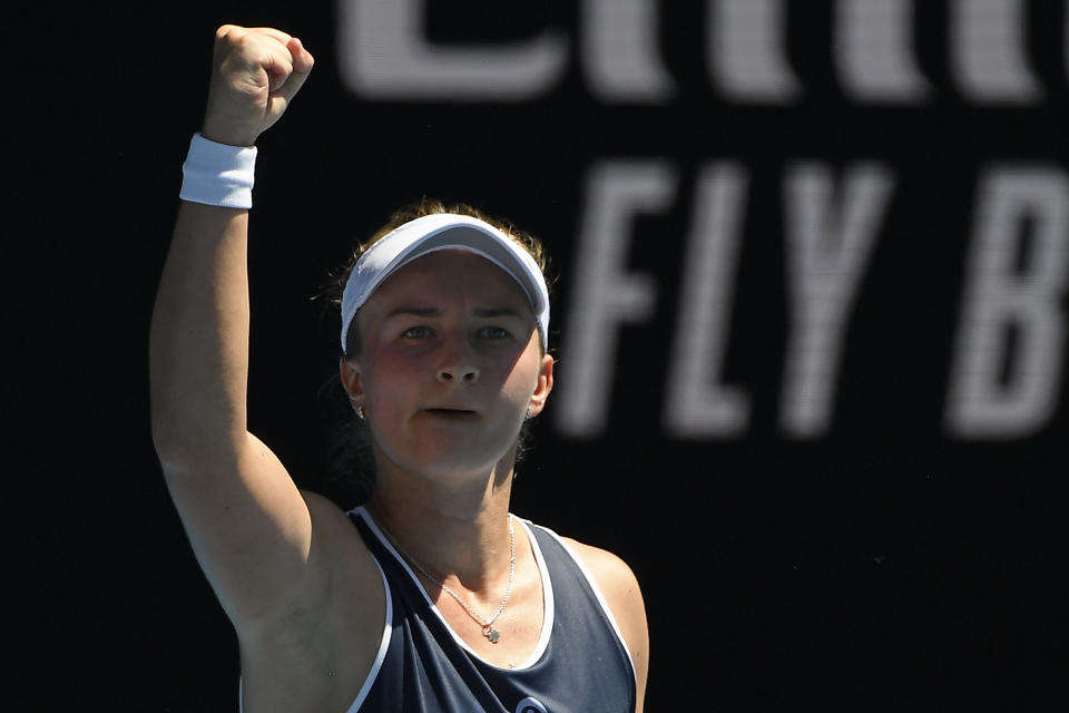 Barbora Krejcikova of the Czech Republic celebrates after defeating Jelena Ostapenko of Latvia in their third round match at the Australian Open tennis championships in Melbourne, Australia, Friday, Jan. 21, 2022. (AP Photo/Andy Brownbill)