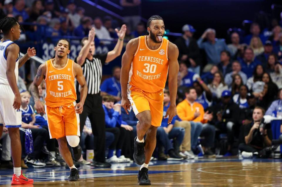 Tennessee guard Josiah-Jordan James (30) reacts after making a 3-point shot against Kentucky during Saturday’s game at Rupp Arena. James, who had struggled significantly shooting 3-pointers in SEC games this season, made four 3s and tied for the Tennessee team lead with 26 points.