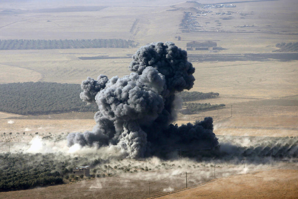 Smoke rises at Islamic State militants’ positions in the town of Naweran