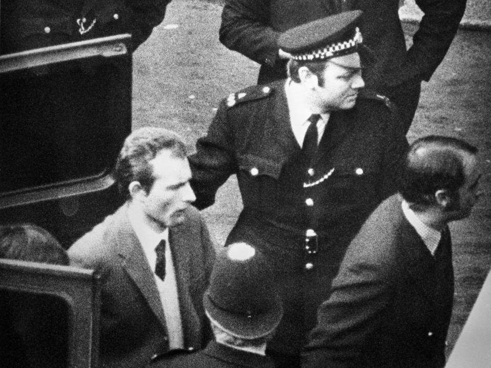 Ian Ball is led into court in March 1974