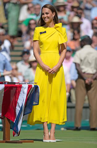 <p>Visionhaus/Getty</p> Kate Middleton during presentation for the Ladies' Singles Final match trophy at Wimbledon in 2022.