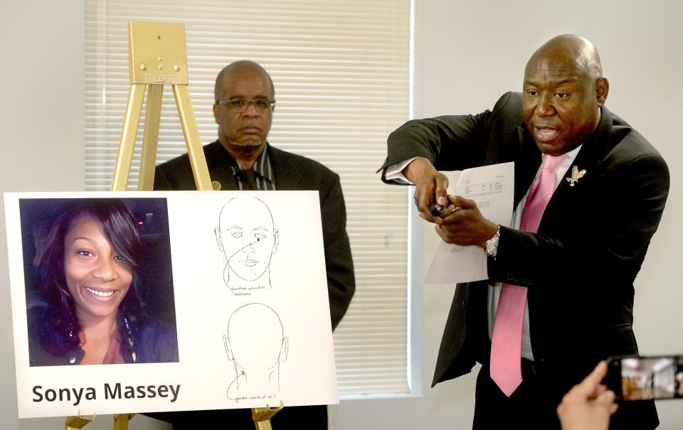 Civil rights attorney Ben Crump, right, makes a gesture mimicking how he thought Sangamon County Sheriff's Deputy Sean Grayson held his gun when he shot Sonya Massey. Crump held a press conference on July 26, 2024, where he showed autopsy diagrams how the bullet entered and exited Massey.