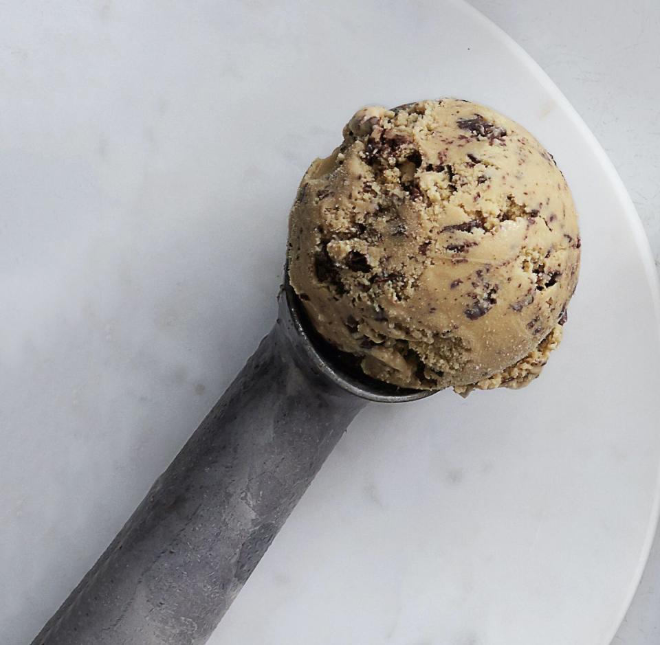 a scoop of espresso chip ice cream in an ice cream scooper