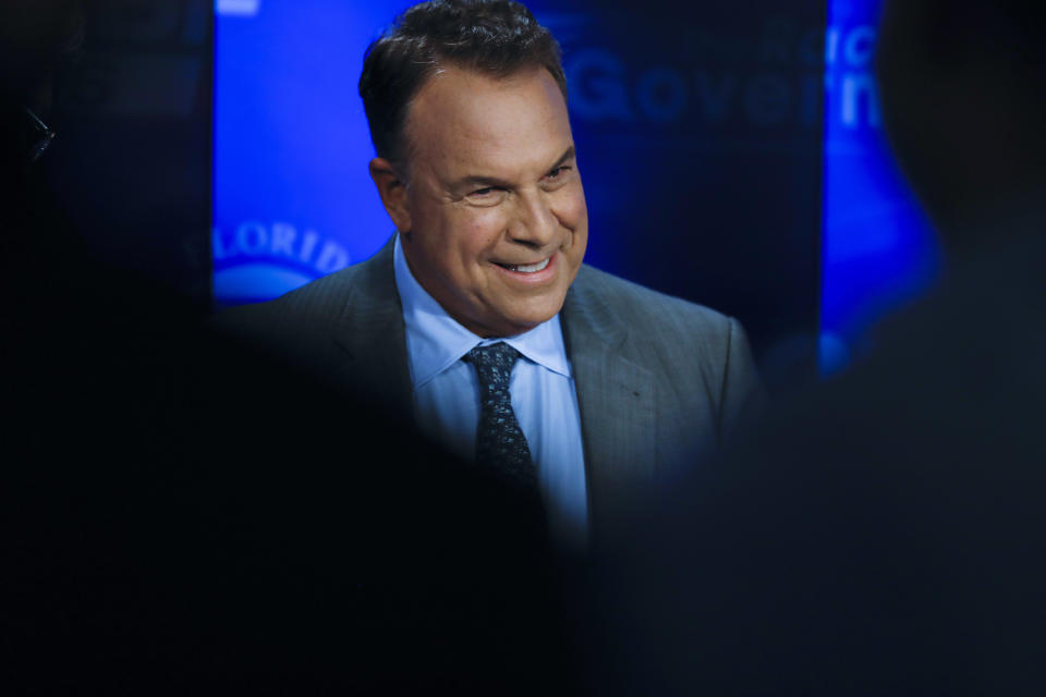 Democratic gubernatorial candidate Jeff Greene awaits the start of a debate ahead of the Democratic primary for governor, Thursday, Aug. 2, 2018, in Palm Beach Gardens, Fla. (AP Photo/Brynn Anderson)