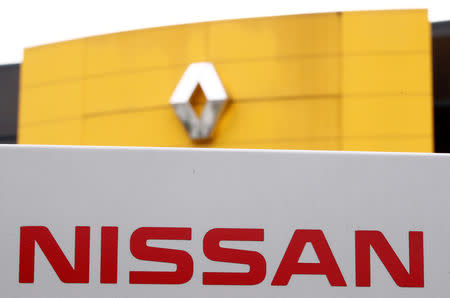 FILE PHOTO: The logos of car manufacturers Renault and Nissan are seen in front of a common dealership of the companies in Saint-Avold, France, January 15, 2019. REUTERS/Christian Hartmann