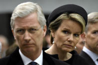 Belgium's King Philippe and Queen Mathilde attend a one year anniversary service at Maelbeek metro station in Brussels, Wednesday March 22, 2017. Belgian leaders, victims and families of those who died in the suicide bomb attacks on the Brussels airport and subway are marking the first anniversary of the attacks, which killed 32 people and wounded more than 300 others. (Didier Lebrun/Pool via AP)