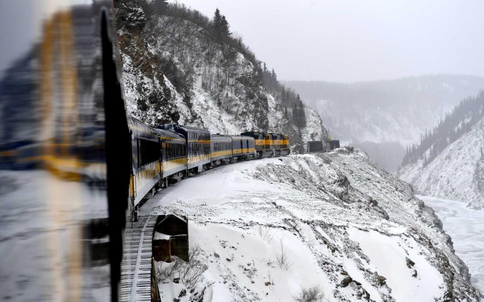 The northbound Alaska Railroad's Denali Star heads through the Nenana River Gorge as it makes its way to Fairbanks February 27, 2018 in Healy, AK