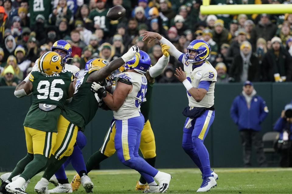 Los Angeles Rams' Matthew Stafford throws during the first half of an NFL football game against the Green Bay Packers Sunday, Nov. 28, 2021, in Green Bay, Wis. (AP Photo/Morry Gash)