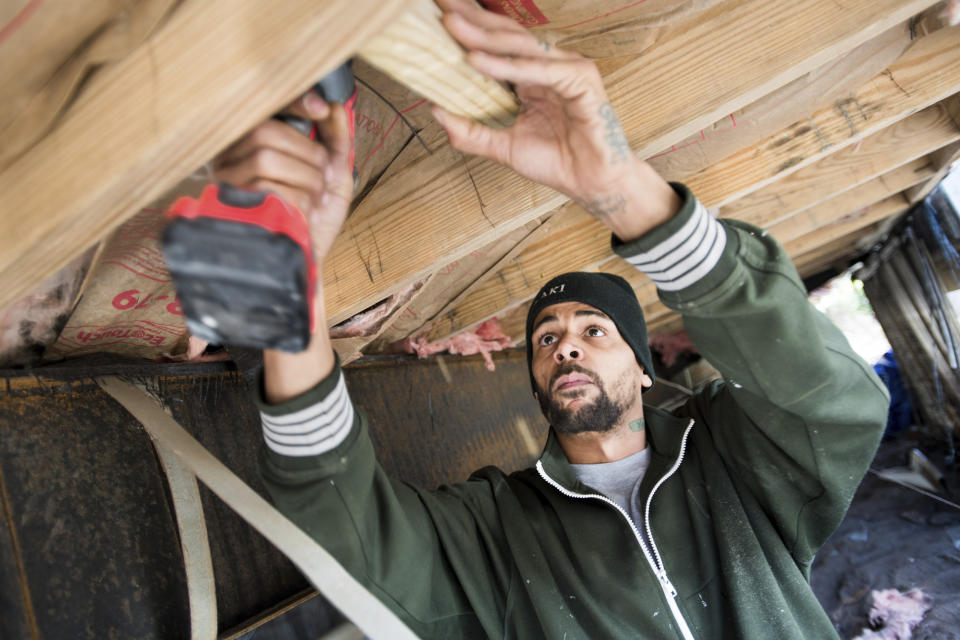 Joshua Voaklander works to repair his home damaged by flooding from Hurricane Florence Friday, Feb. 1, 2019, in Conway, S.C. Voaklander says that if floodwaters come inside the house again, he is moving. (AP Photo/Sean Rayford)