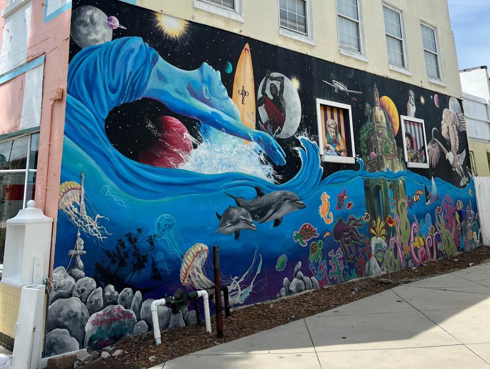 wave mural on the side of a building in jacksonville beach florida