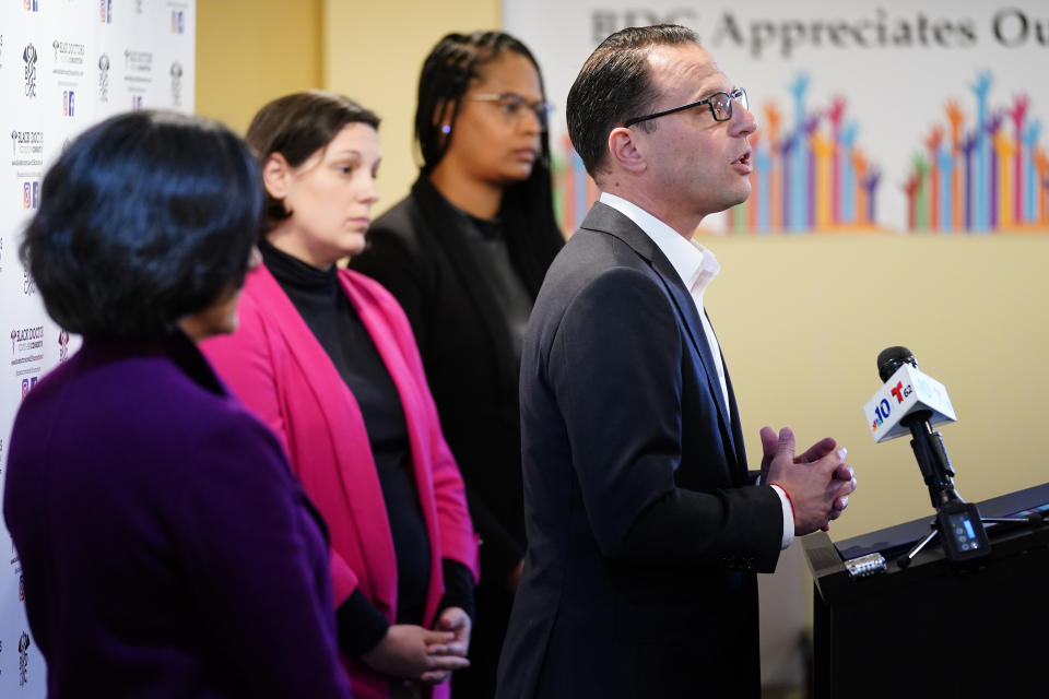 FILE - Pennsylvania candidate for governor, state Attorney General Josh Shapiro, at podium, speaks during a news conference in Philadelphia, Tuesday, Oct. 4, 2022, accompanied by Montgomery County Commissioner Val Arkoosh, State Sen. Amanda Cappelletti, and State Rep. Morgan Cephas, D-Philadelphia. In one of the most closely watched races in one of the most contested battleground states, both candidates for governor in Pennsylvania bring religion into their campaigns. (AP Photo/Matt Rourke, File)