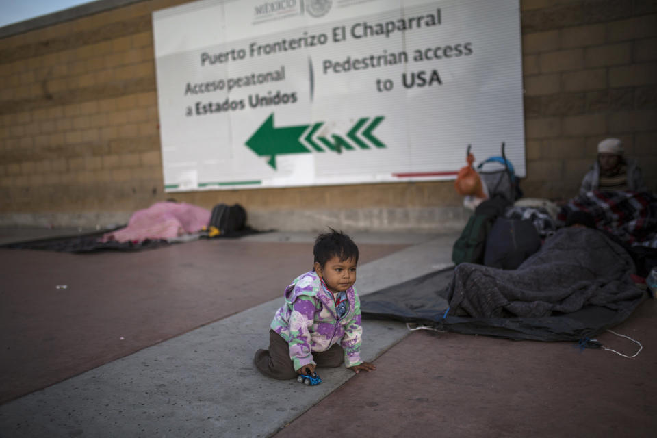Steven Aguila, 2, from El Salvador, plays with a toy car at El Chaparral border crossing in Tijuana, Mexico, on Nov. 23. (Photo: ASSOCIATED PRESS)