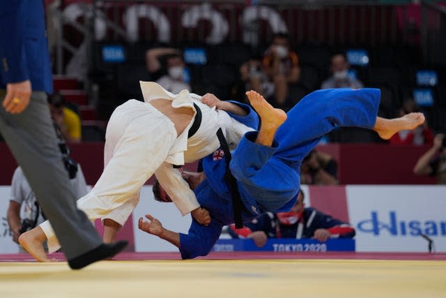 Japan's Yujiro Seto (left) defeats Georgia's Giorgi Gamjashvili in men's 66kg judo bronze medal match