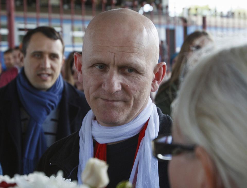 FILE - In this Saturday, June 21, 2014 file photo, Belarusian human rights advocate Ales Bialiatski is welcomed by his supporters at a railway terminal in Minsk, Belarus. The prominent Belarus opposition figure Ales Bialiatski and leading imprisoned Iranian human rights lawyer Nasrin Sotoudeh have been awarded the 2020 Swedish Right Livelihood Award, sometimes referred to as the “Alternative Nobel,” along with activists from Nicaragua and the United States. (AP Photo/Dmitry Brushko, File)