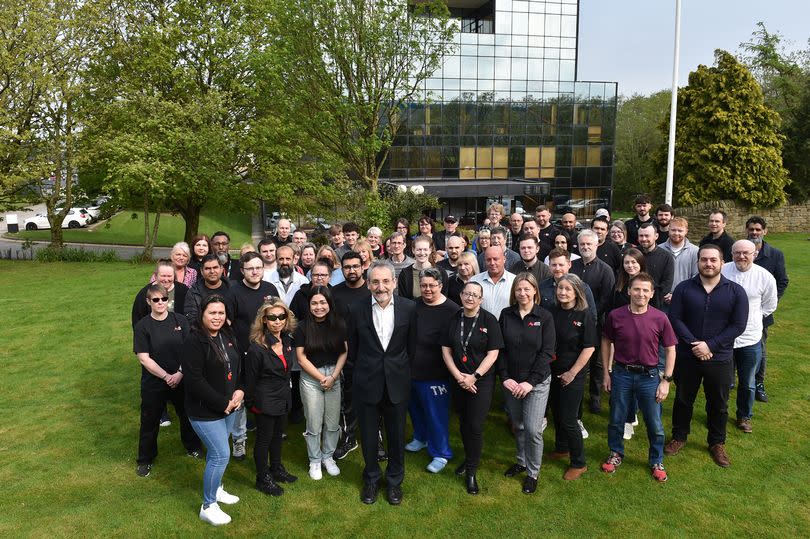 Mark Crabtree, OBE, centre, with the team at Burnley-based sound recording specialist AMS Neve