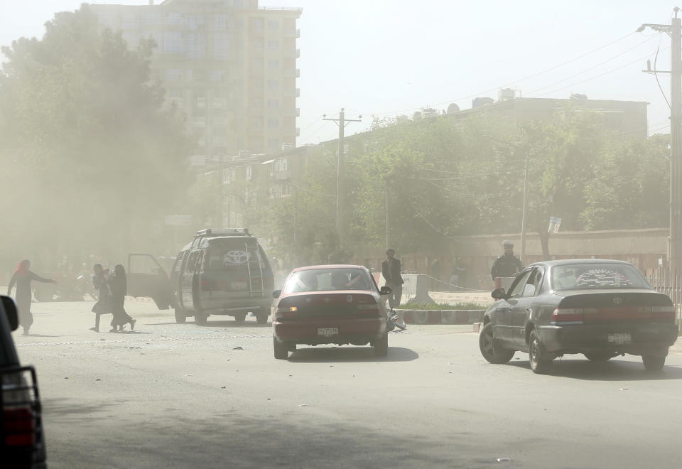 <p>People leave the site of a suicide attack after the second bombing in Kabul, Afghanistan, April 30, 2018. (Photo: Massoud Hossaini/AP) </p>