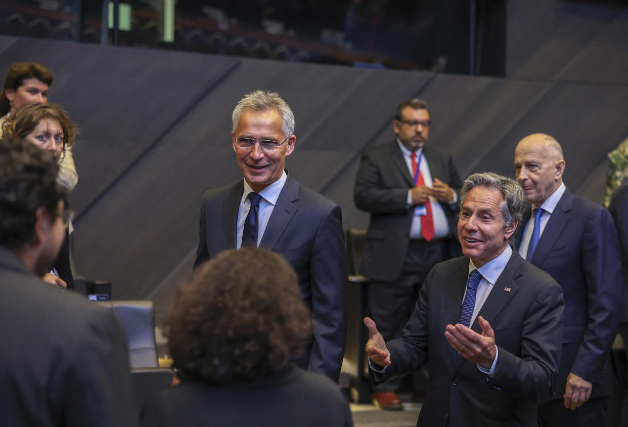 NATO Secretary General Jens Stoltenberg, center, and US Secretary of State Antony Blinken, second right, greet participants prior to a meeting of NATO ambassadors at NATO headquarters in Brussels, Friday, Sept. 9, 2022. (AP Photo/Olivier Matthys, Pool)