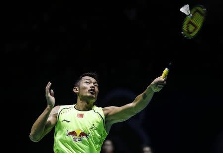 China's Lin Dan returns a shot to India's Kidambi Srikanth during their men's singles final at Badminton China Open in Fuzhou, Fujian province, November 16, 2014. REUTERS/Stringer