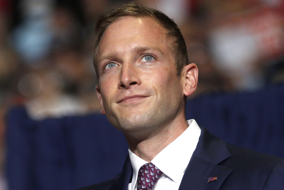 FILE - Max Miller, Republican candidate for U.S. Representative for Ohio's 7th Congressional District, takes the stage at a campaign rally in Youngstown, Ohio, Sept. 17, 2022. (AP Photo/Tom E. Puskar, File)