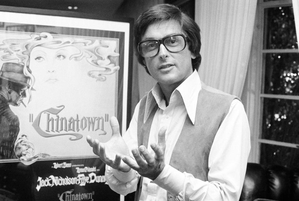 Paramount Pictures production chief Robert Evans talks about his film "Chinatown" in his office in Beverly Hills, Calif., in 1974. Evans, who helped shepherd films including "The Godfather" and "Harold and Maude" to the screen, died on Oct. 26. He was 89. (AP Photo/Jeff Robbins)