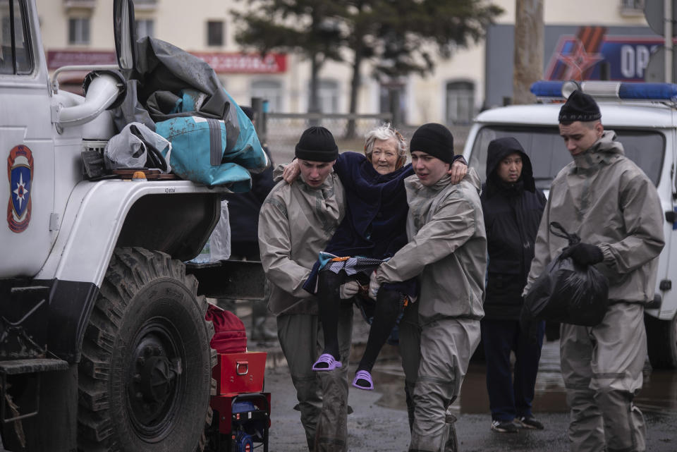 Rescuers carry an elderly woman in a flooded street after part of a dam burst, in Orsk, Russia on Monday, April 8, 2024. Floods caused by rising water levels in the Ural River broke a dam in a city near Russia's border with Kazakhstan, forcing some 2,000 people to evacuate, local authorities said. The dam broke in the city of Orsk in the Orenburg region, less than 12.4 miles north of the border on Friday night, according to Orsk mayor Vasily Kozupitsa. (AP Photo)