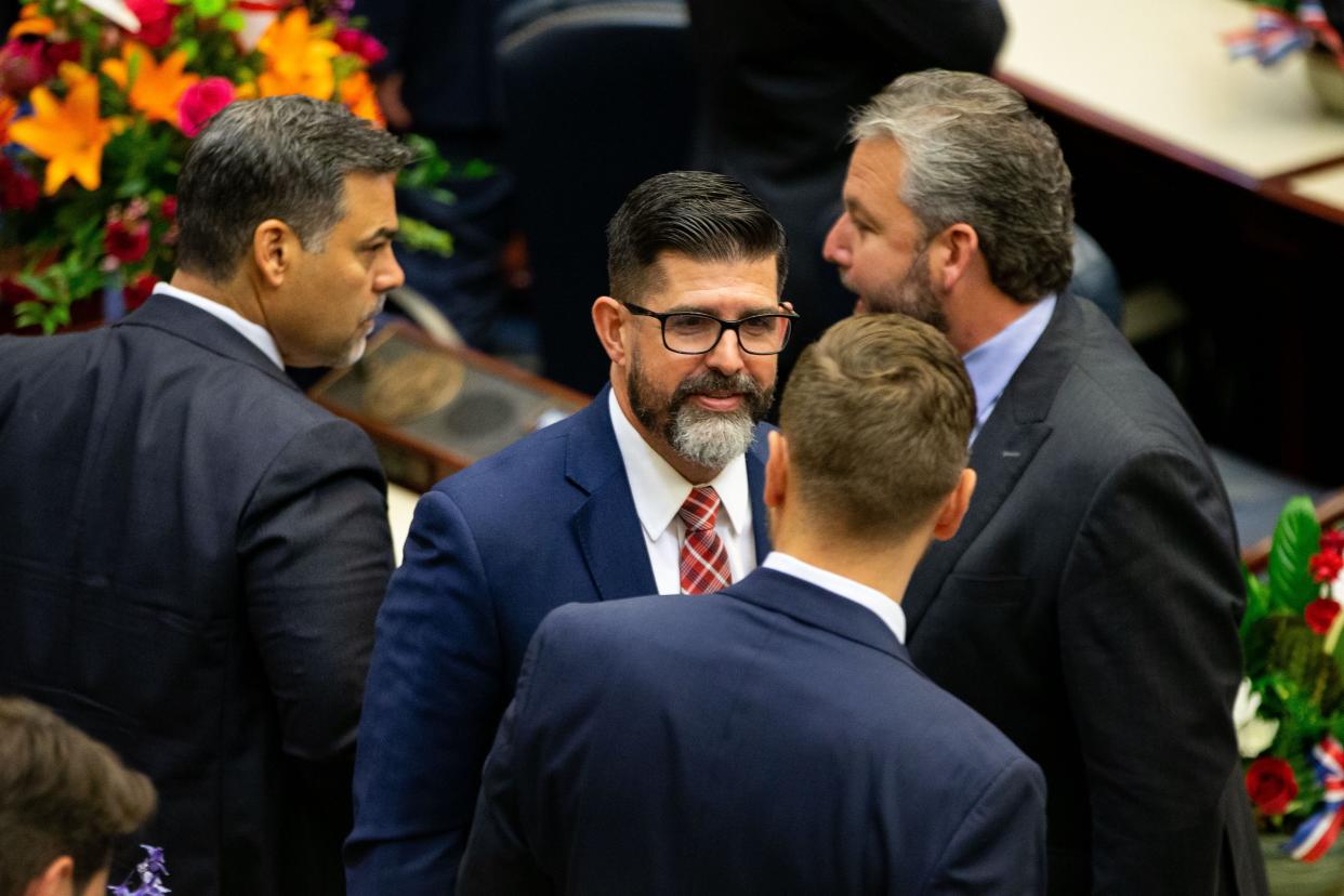 Florida Education Commissioner Manny Diaz talks with his peers during the opening day of the state' 2023 Legislative Session on Tuesday.