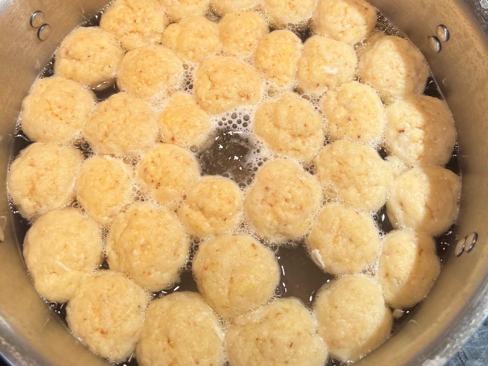 Matzah balls, dumplings made of crushed unleavened bread, and chicken soup can be found on some Seder tables during Passover.