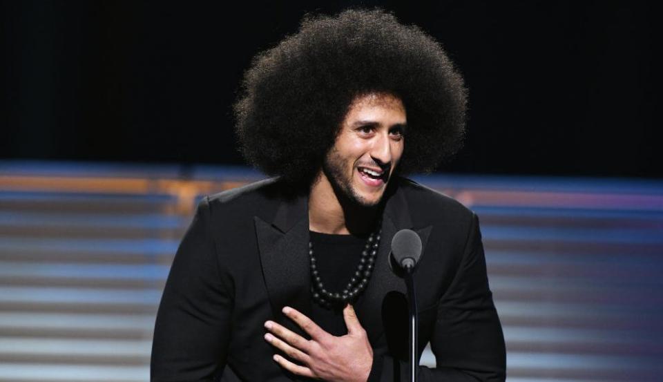 Colin Kaepernick accepts the Sports Illustrated Muhammad Ali Legacy award in December 2017 in New York. (Getty)