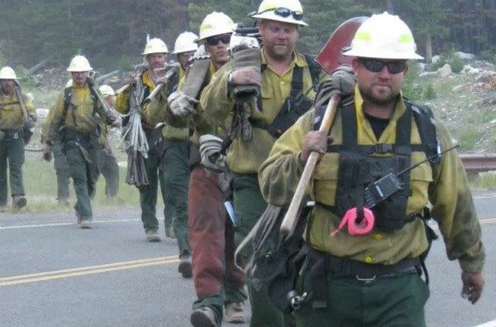 Jason Campbell (right) and his crew of firefighters&nbsp;after a shift fighting the Index Creek Fire in Wyoming's Shoshone National Forest in June 2012. (Photo: <a href="https://www.gofundme.com/carr-fire-devastation" target="_blank">GoFundMe</a>)