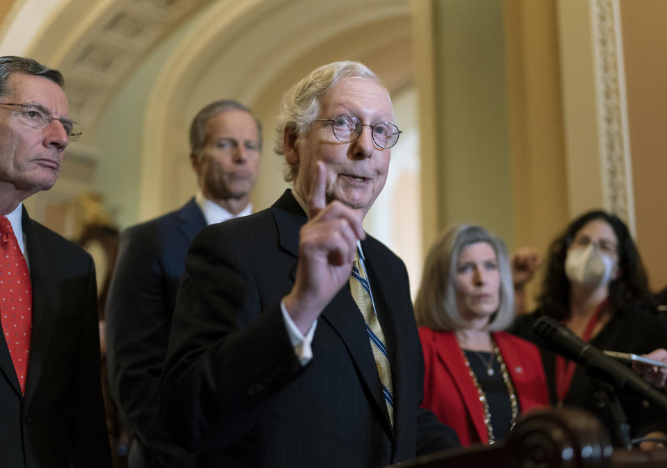 Senate Minority Leader Mitch McConnell, R-Ky., joined from left by Sen. John Barrasso, R-Wyo., and Minority Whip John Thune, R-S.D., speaks to reporters following a GOP strategy meeting, at the Capitol in Washington, Tuesday, Nov. 16, 2021. (AP Photo/J. Scott Applewhite)