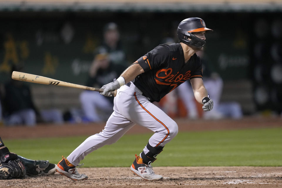 Baltimore Orioles' Adam Frazier watches his RBI double against the Oakland Athletics during the fifth inning of a baseball game in Oakland, Calif., Friday, Aug. 18, 2023. (AP Photo/Jeff Chiu)