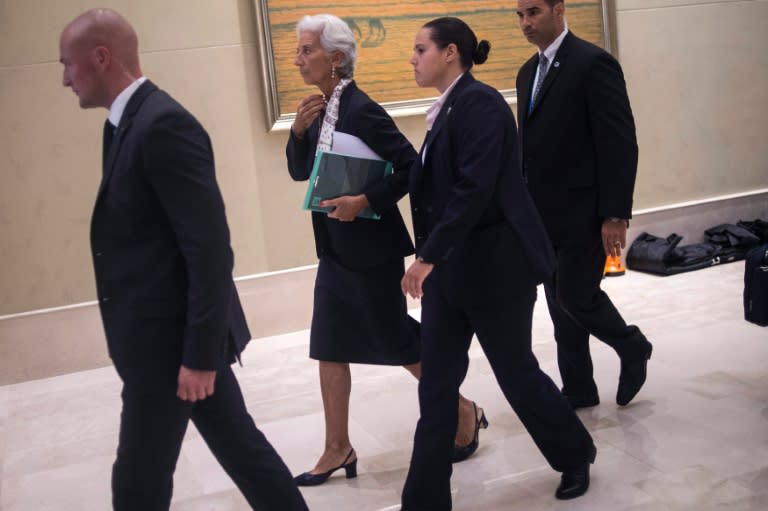 International Monetary Fund (IMF) Managing-Director Christine Lagarde (C) arrives to take part in a meeting of G20 finance ministers, in Chengdu, China's south-western Sichuan province, on July 23, 2016